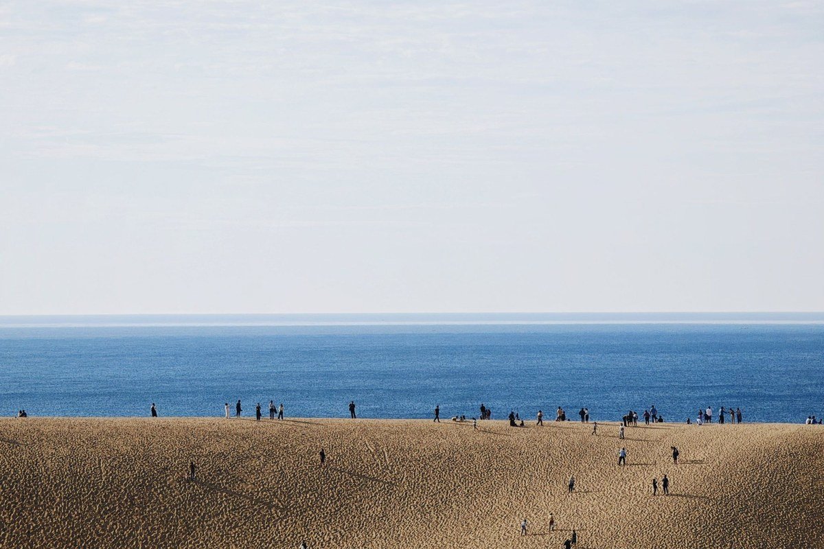 Indiana Dunes National Park sand dunes with Chicago skyline visible across Lake Michigan