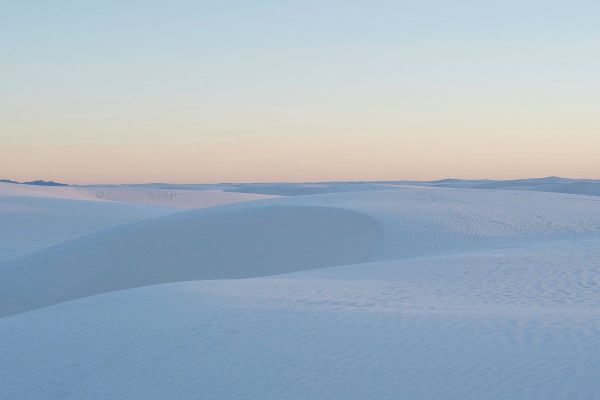 Monahans Sandhills State Park Texas empty rolling dunes with sand sledding trails at dusk