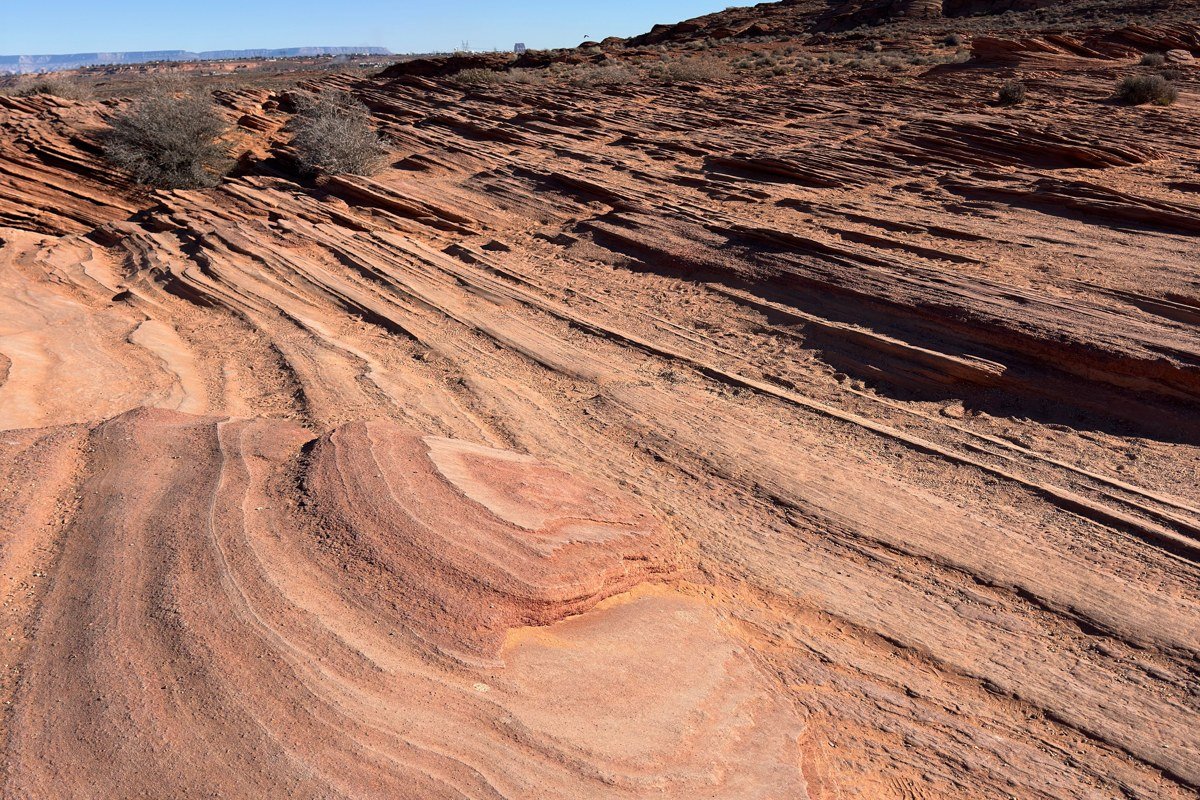 wide desert canyon landscape Southwest USA layered rock and open sky at golden hour