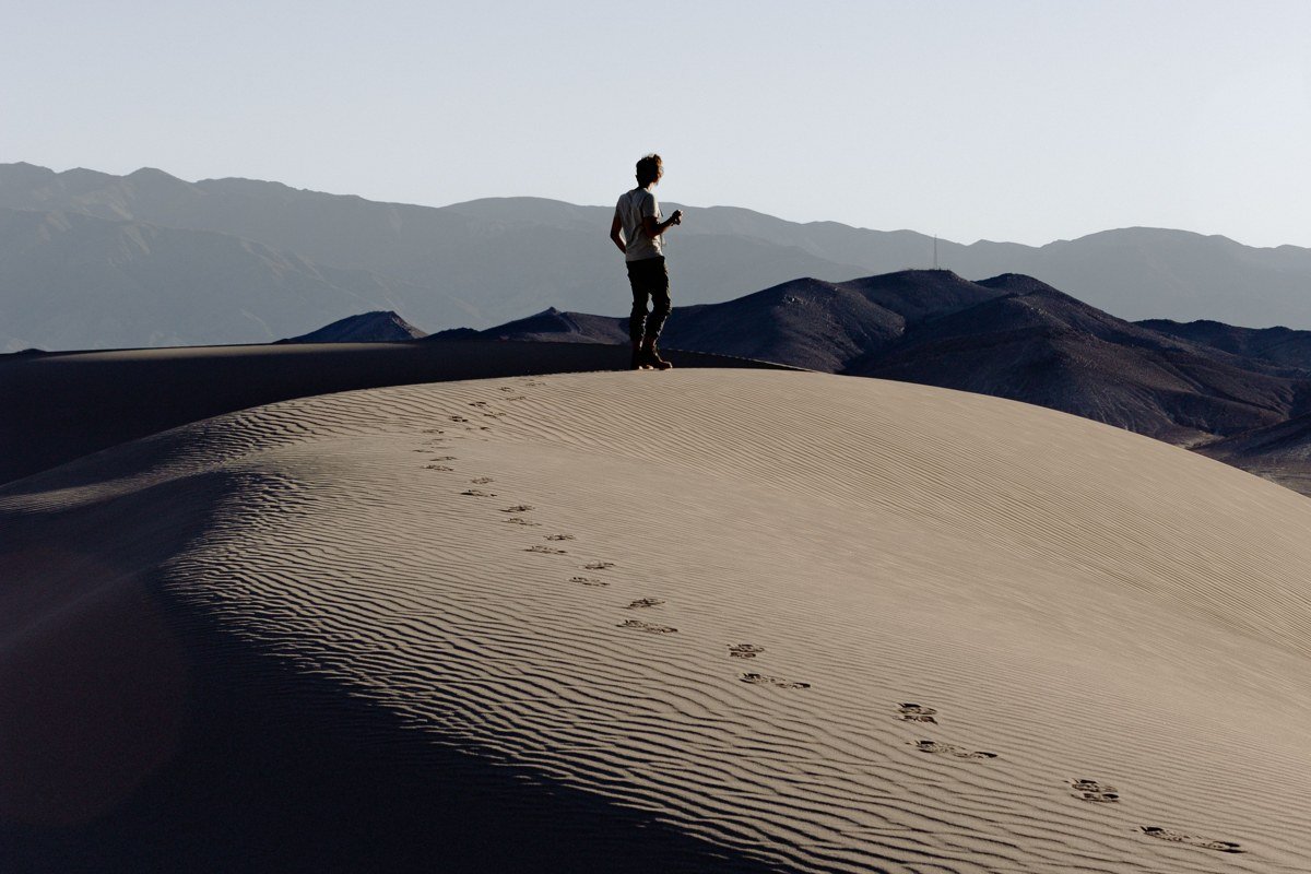 Mesquite Flat Sand Dunes Death Valley California rippled dunes at sunrise with footprints