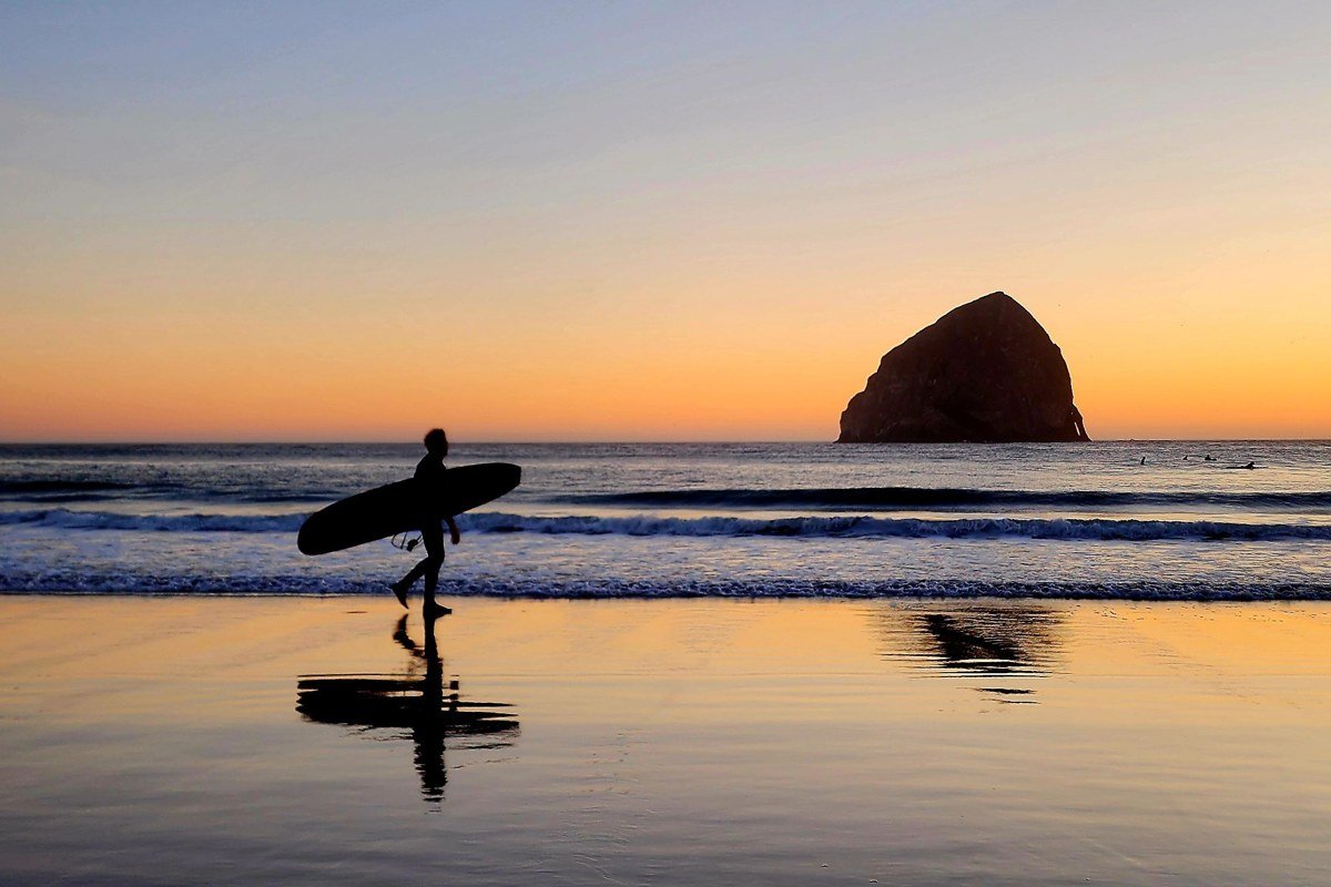 Haystack Rock, Cannon Beach, its base lost in a bank of rolling coastal fog