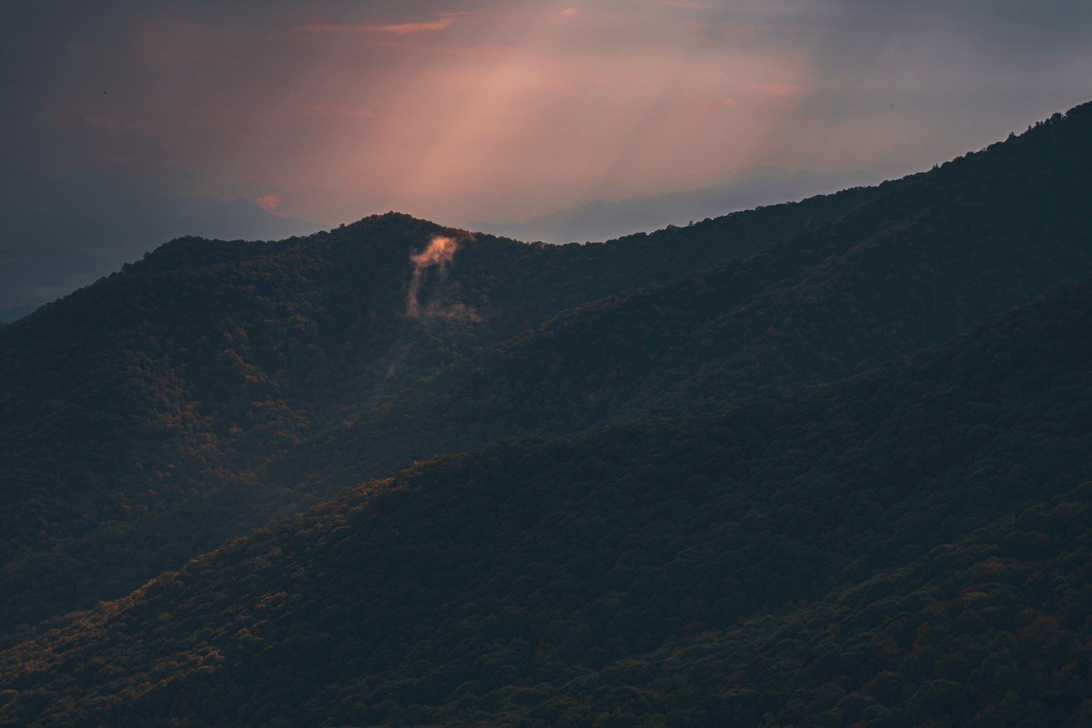 Newfound Gap overlook sunrise straddling Tennessee North Carolina state line with fog below
