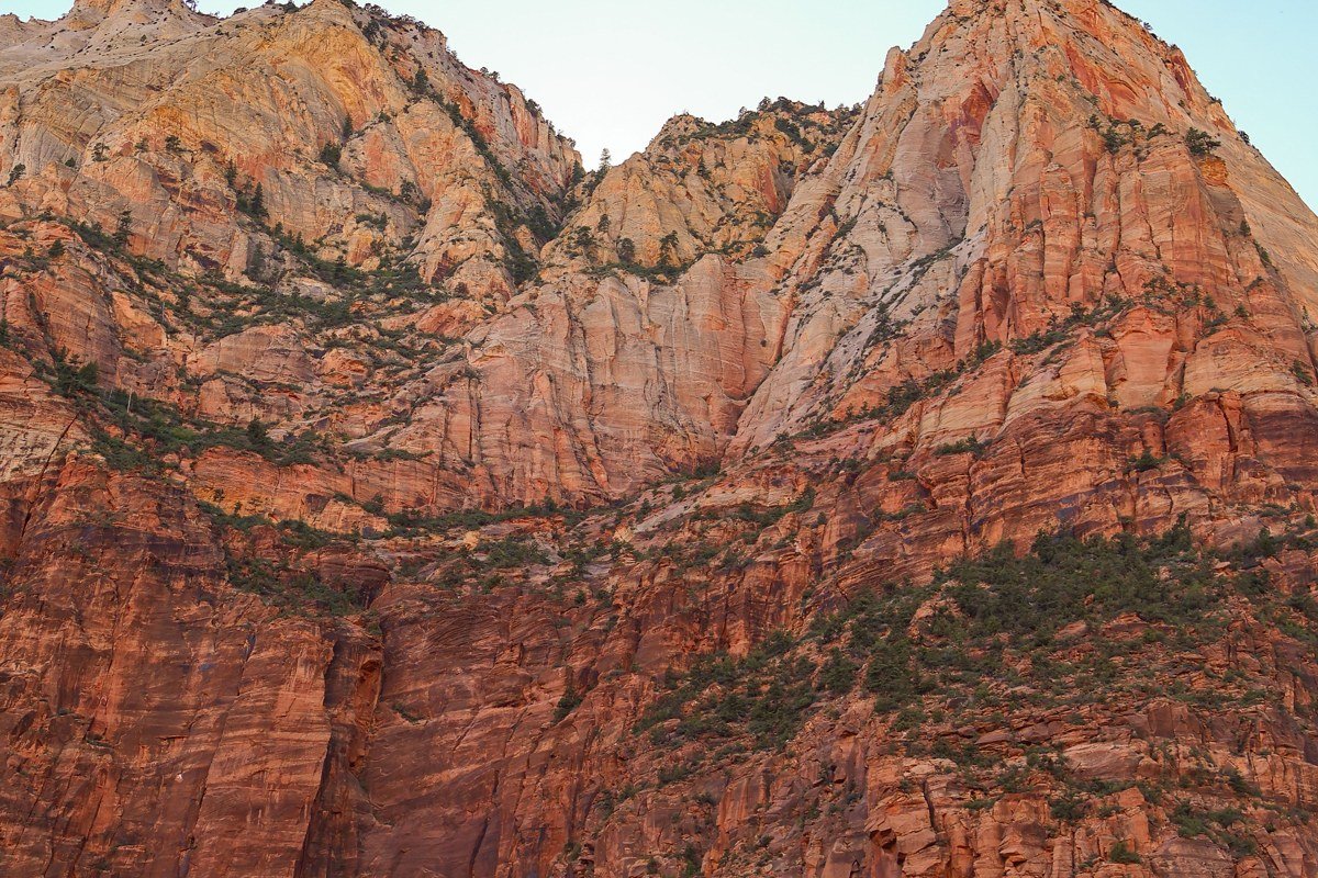 Watchman Trail Zion National Park view of Springdale and red cliffs at sunrise