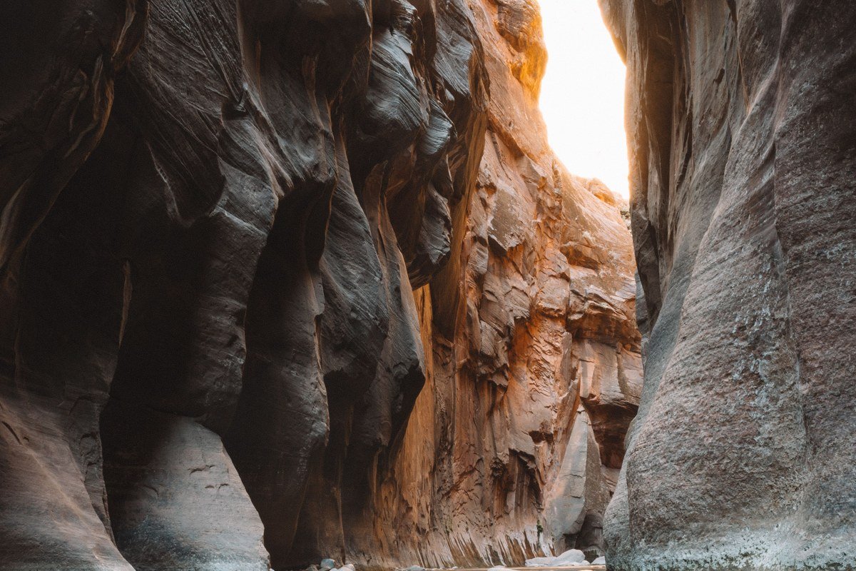 The Subway Zion tunnel-shaped canyon turquoise pools green light