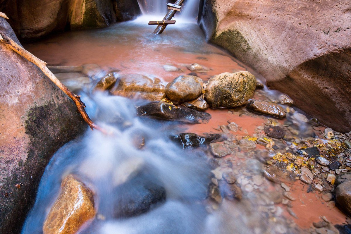 Pine Creek Canyon Zion rappel into pool dark narrow walls