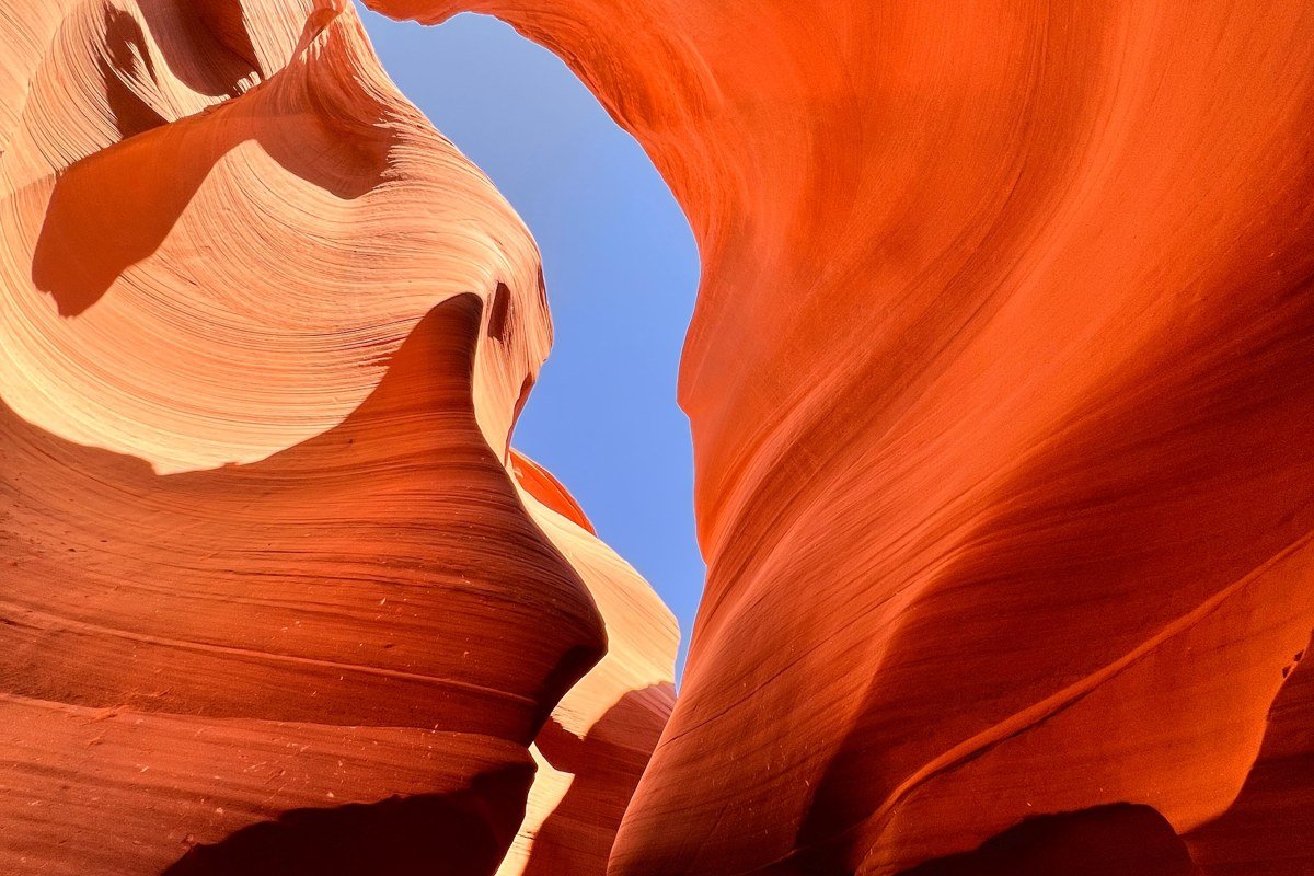 Subway slot canyon Zion bottom-up route with tube-shaped orange walls and pothole pools