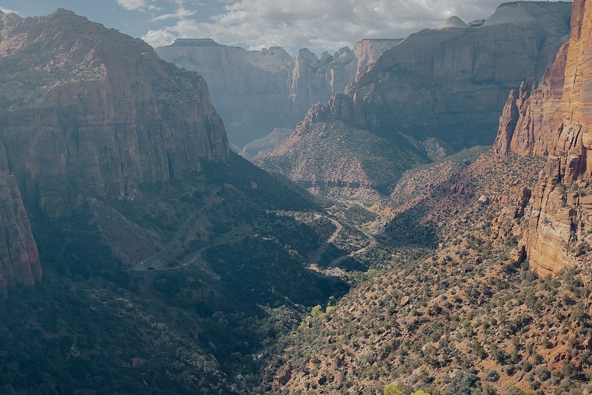rappeller descending Behunin Canyon Zion with multiple pitches and Zion Canyon views below