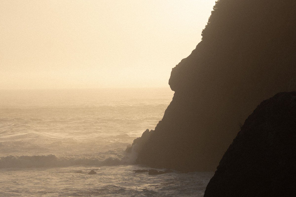 moody fog rolling through sea stacks on the Oregon Coast at dawn, Pacific Ocean, Oregon