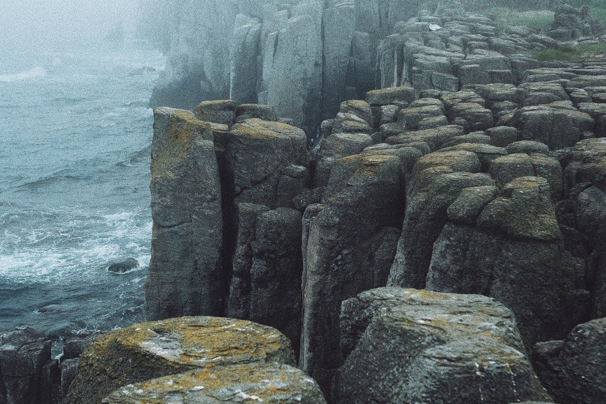 dramatic cliff drop and fog rolling over Cape Perpetua headland, Oregon coast