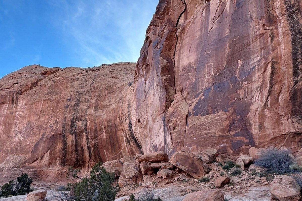 red rock arches at sunset with La Sal Mountains in background, Arches National Park Utah