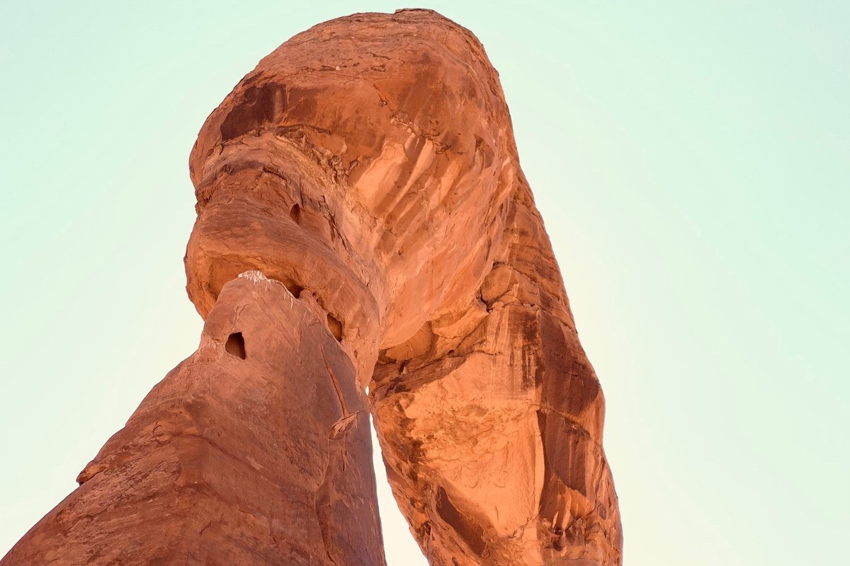 Devils Garden trail desert fins and distant arches Arches National Park
