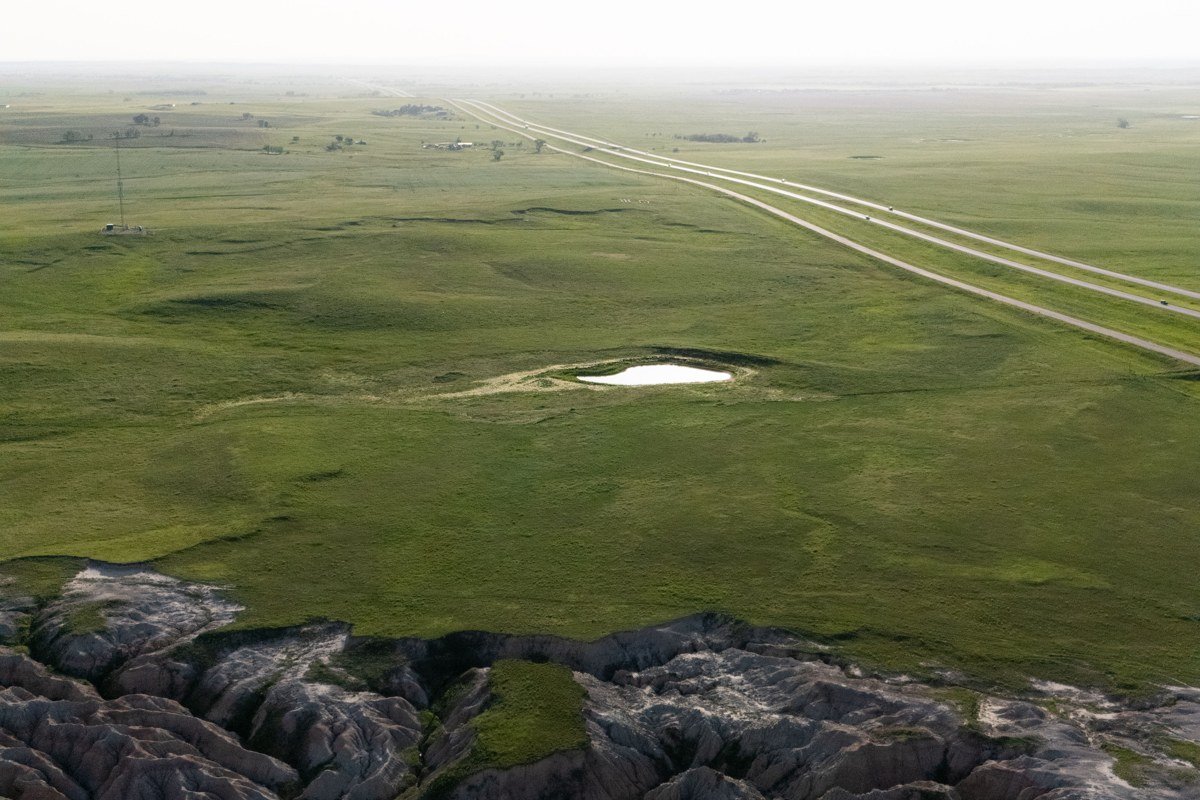 Big Badlands Overlook South Dakota fog pooling in canyon at sunrise