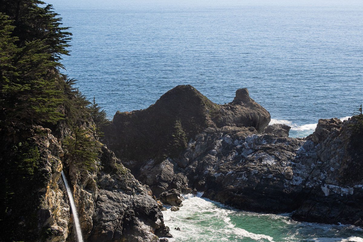 Partington Cove tunnel opening onto rocky cove with steep unguarded ledge, Big Sur California