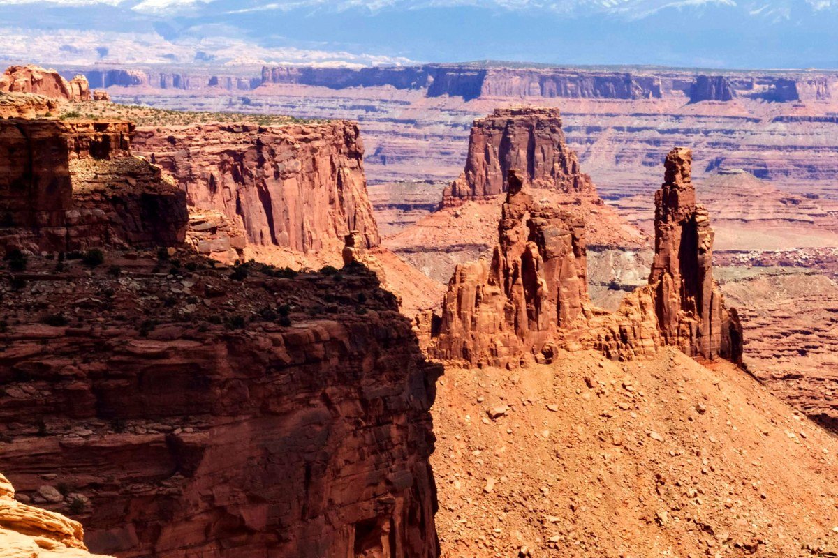 Candlestick Tower Overlook Canyonlands with a tall slender rock spire rising from the canyon floor