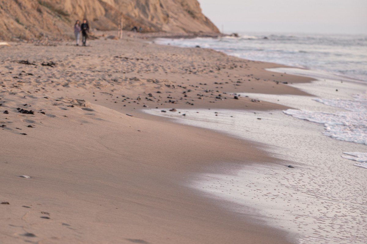 Nauset Light Beach red and white lighthouse above sandy bluff