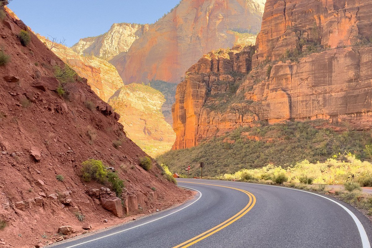 Zion National Park Utah red canyon walls with Virgin River and shuttle road, golden hour light