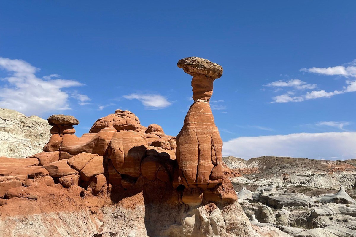 Goblin Valley State Park, Utah, hoodoo formations scattered across the valley floor, shot from ground level among the rocks rather than from the overlook