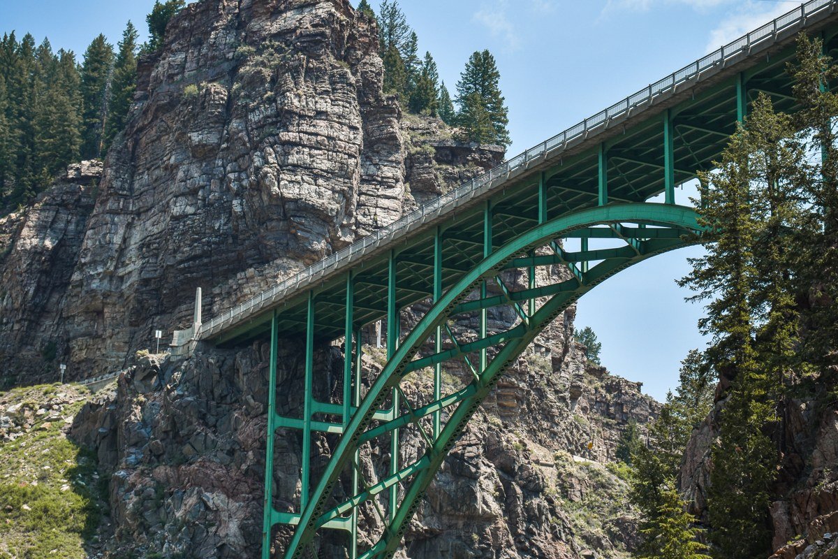 Royal Gorge Colorado rafting raft dwarfed by thousand foot granite canyon walls
