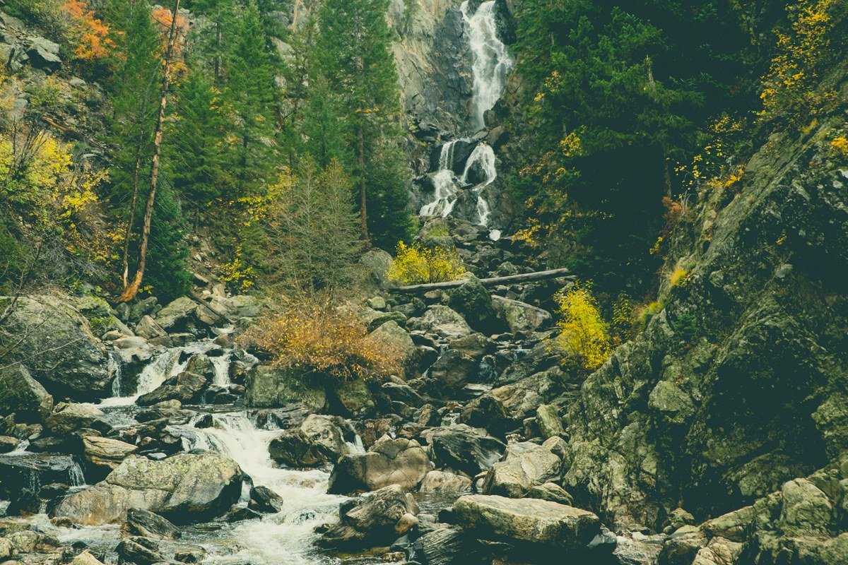 Pine Creek rapid Arkansas River Colorado whitewater steep drop with rafters leaning into wave