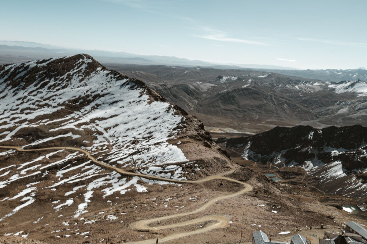 Telescope Peak Trail with snow on the summit ridge overlooking Death Valley desert floor far below