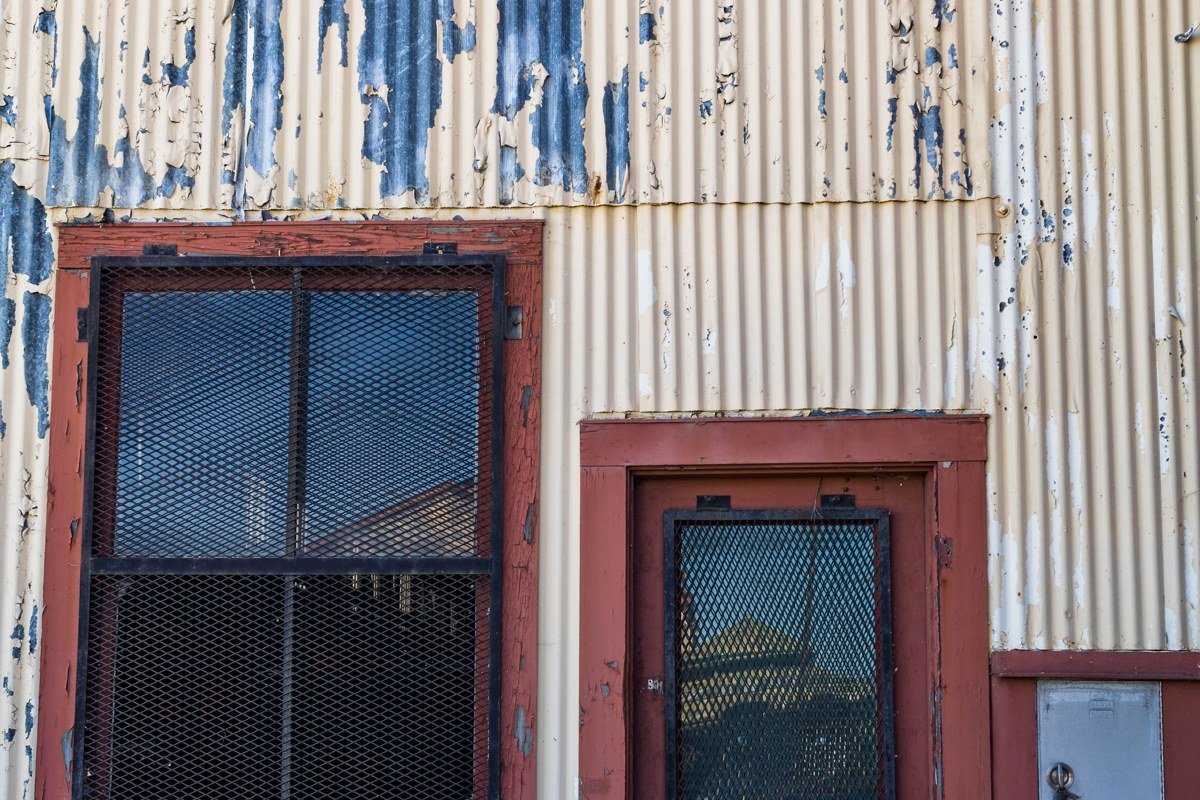 Amargosa Opera House exterior in Death Valley Junction with hand-painted murals visible through doorway