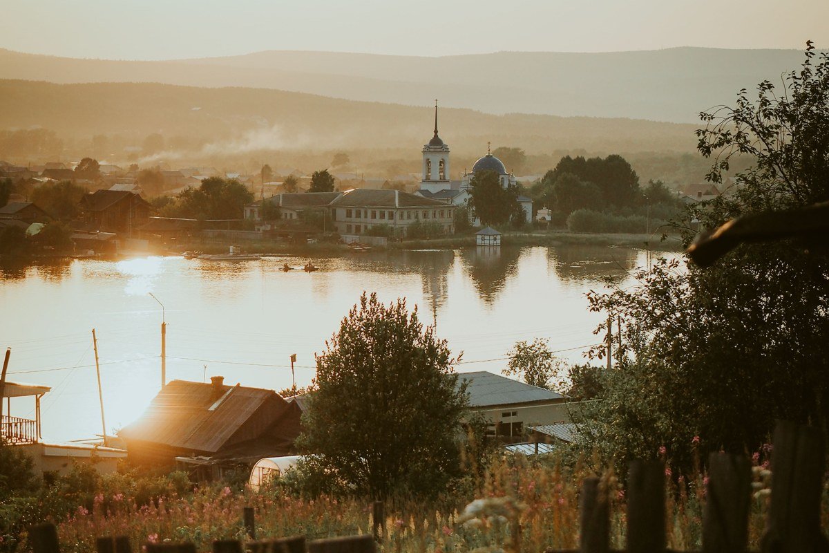 Canandaigua Lake bluff view with mist over water and distant hills