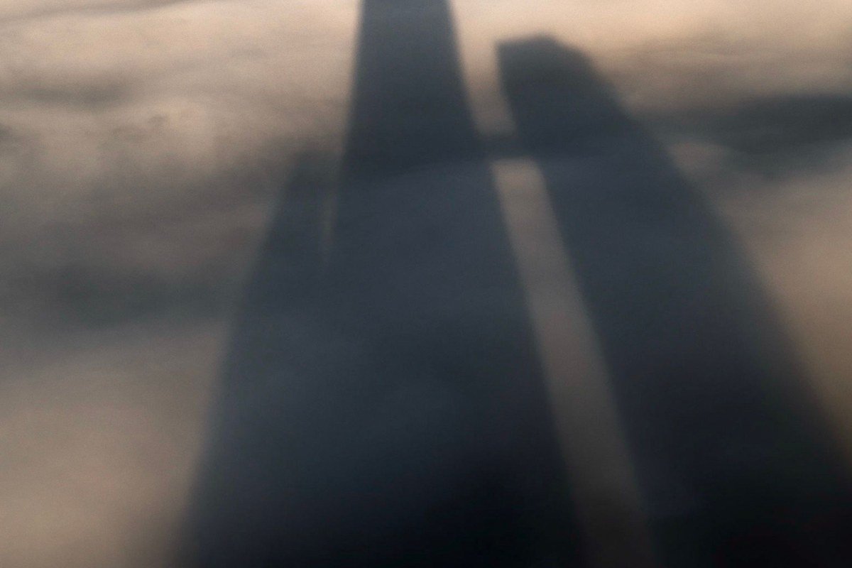 Look Rock observation tower silhouette above layered fog-filled valleys at sunrise