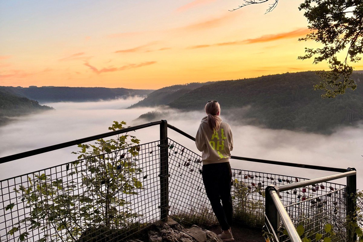 Foothills Parkway Spur overlook with golden sunrise light breaking through valley mist