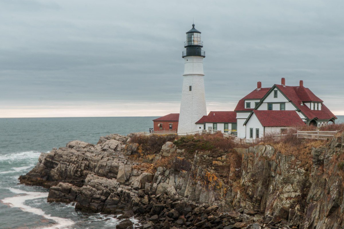 Marshall Point Light Maine lighthouse with wooden walkway disappearing into fog