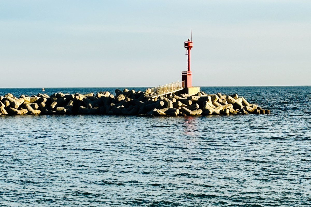 Rockland Breakwater Light Maine lighthouse at end of long stone breakwater in fog