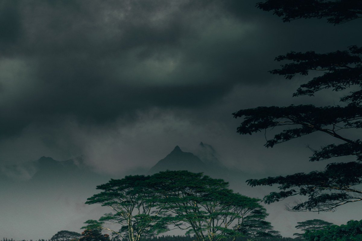 Kaaawa Valley Oahu green cliffs and taro fields under low clouds