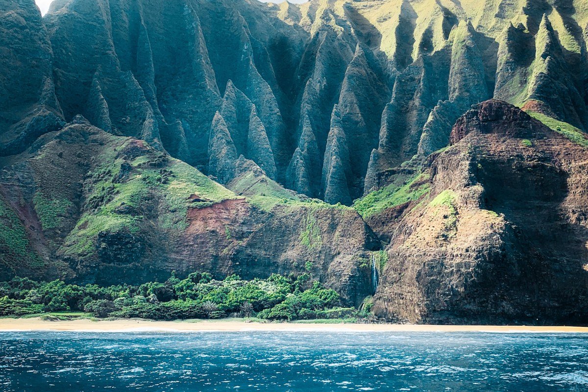 Polihale State Park Kauai wide empty beach backed by Na Pali cliffs
