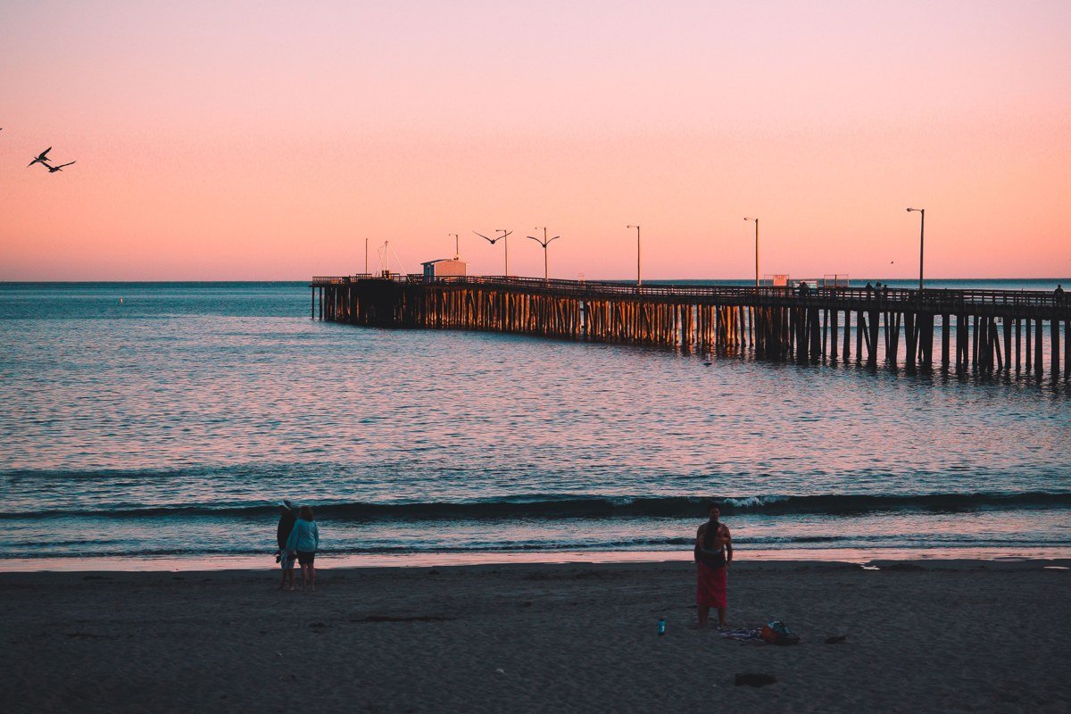 Kings Beach California public beach at sunrise with pier silhouette