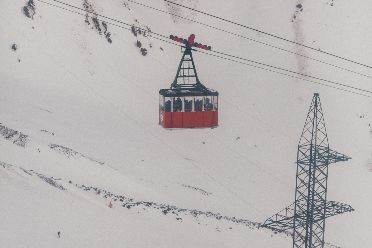 South Lake Tahoe California gondola cars climbing above the lake on Heavenly ski resort