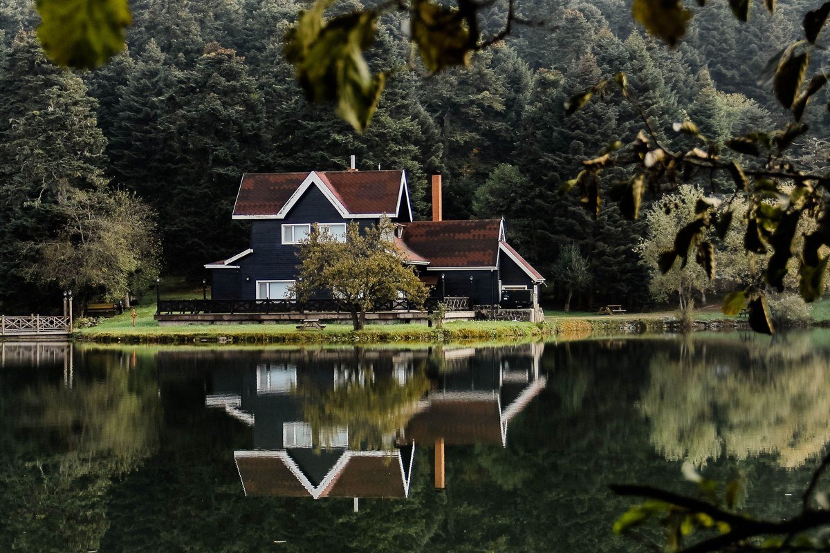 Tahoma California lakeside cabin with old growth pines and snow dusted roof