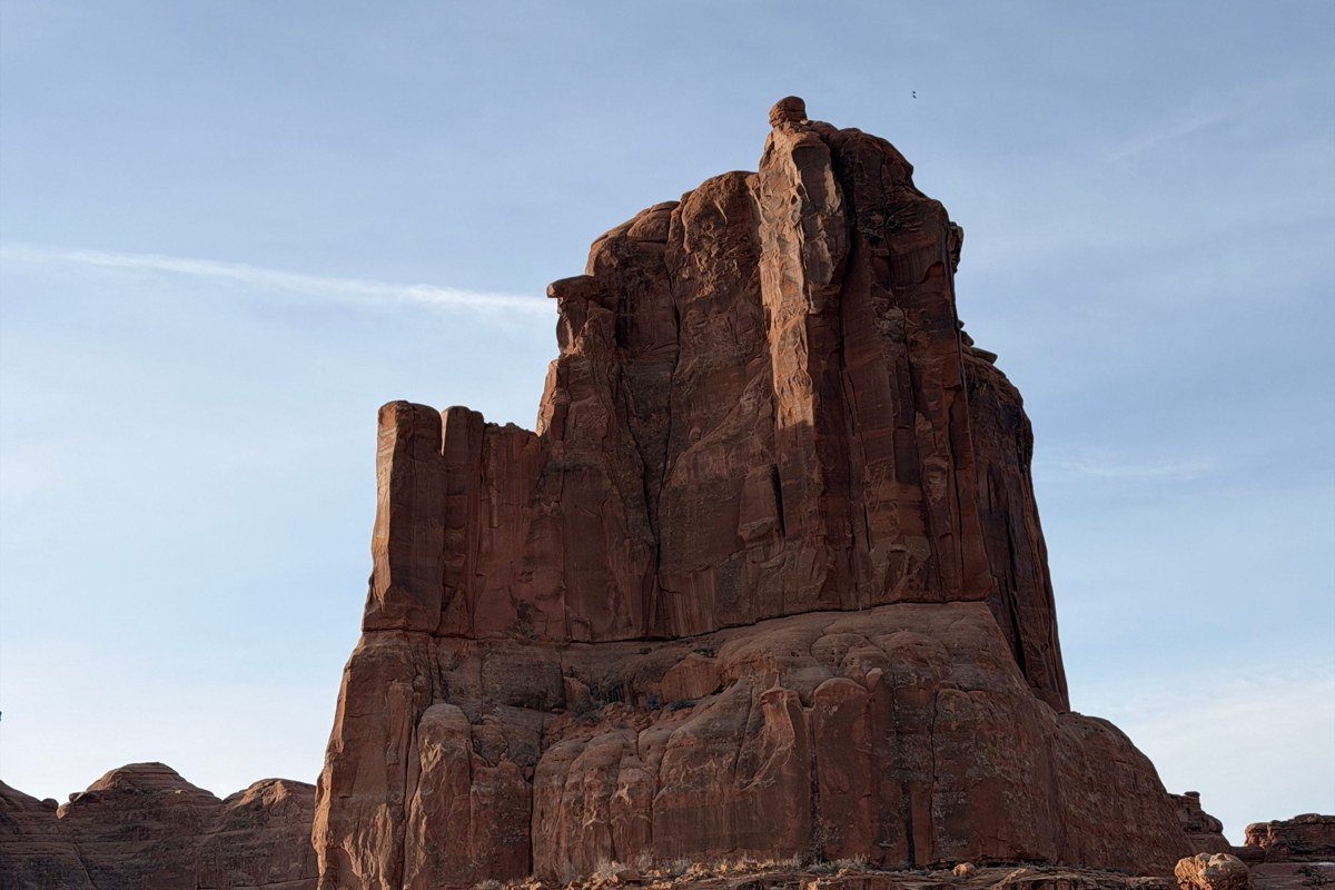 Fisher Towers red rock spires at sunrise with long shadows, Utah