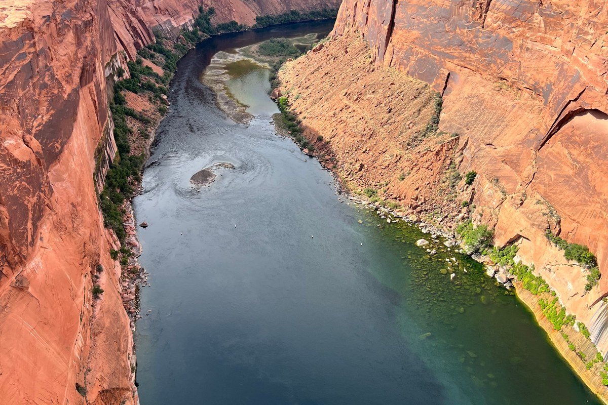 Colorado River rafting near Moab Utah with red canyon walls