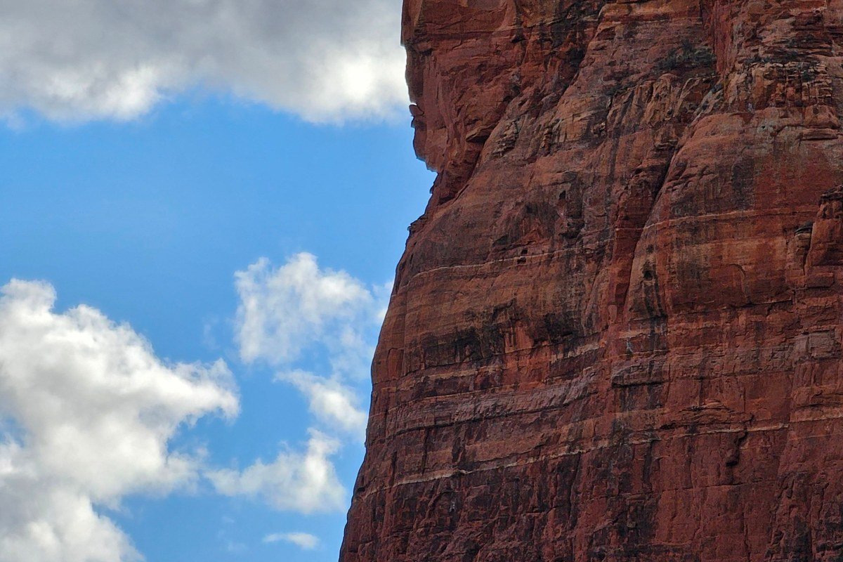 Chapel of the Holy Cross Sedona Arizona built into red rock cliff with cross silhouette