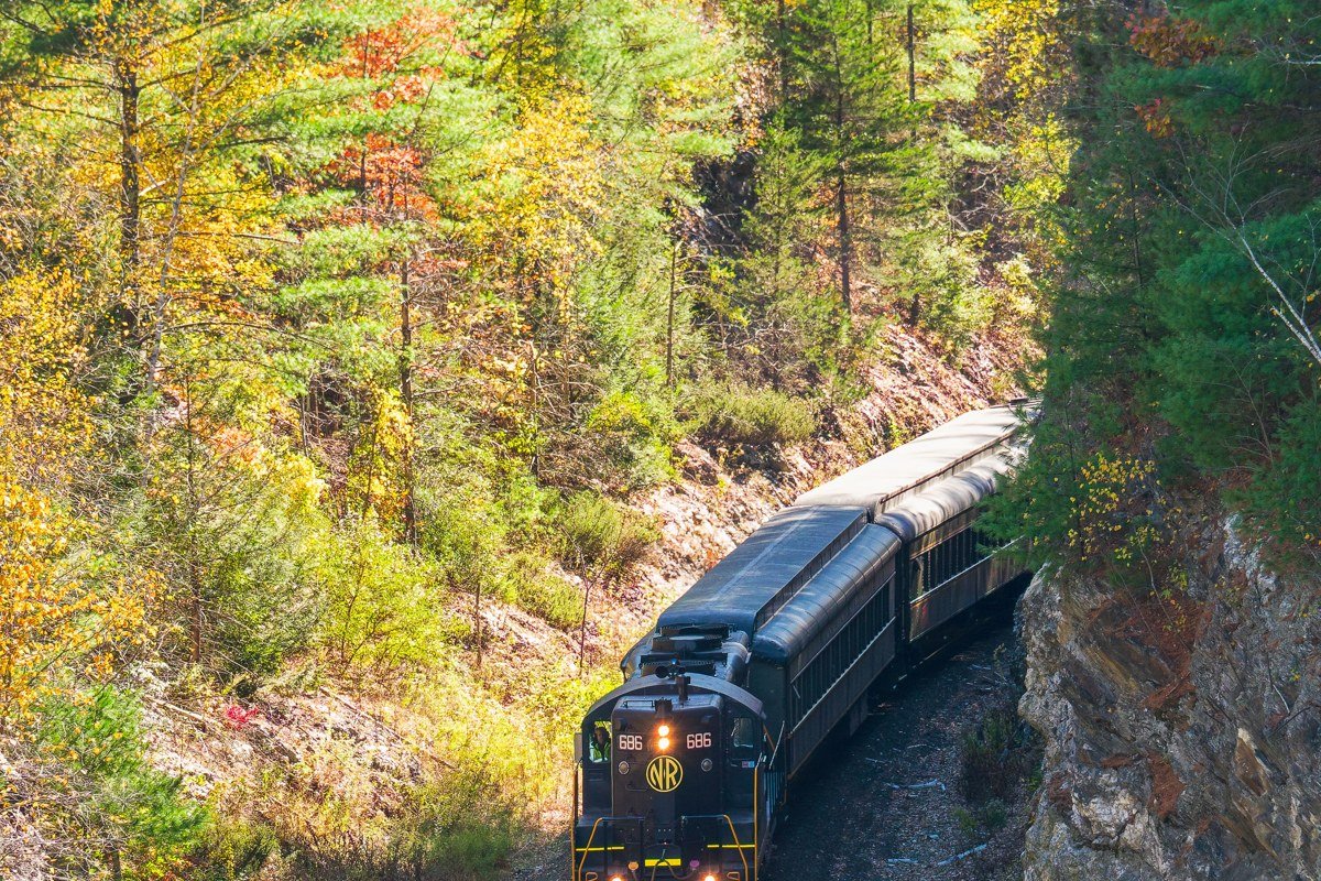 Oregon Coast Scenic Railroad vintage train along Tillamook Bay with autumn light