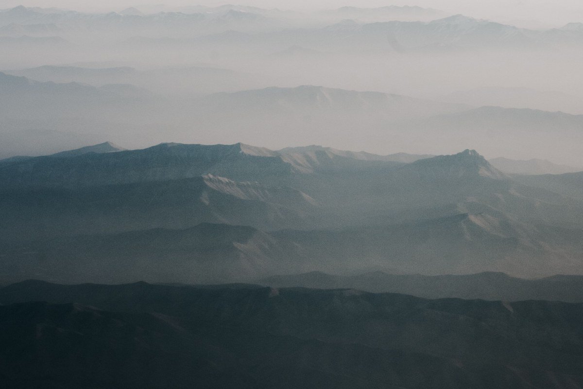 layered blue ridgeline at dawn with fog pooling in the valleys, Great Smoky Mountains