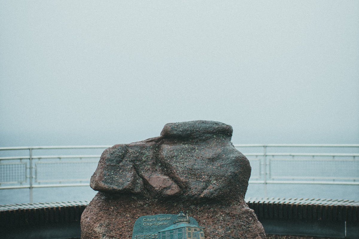 St. Ignace Michigan waterfront with Mackinac Bridge fading into fog