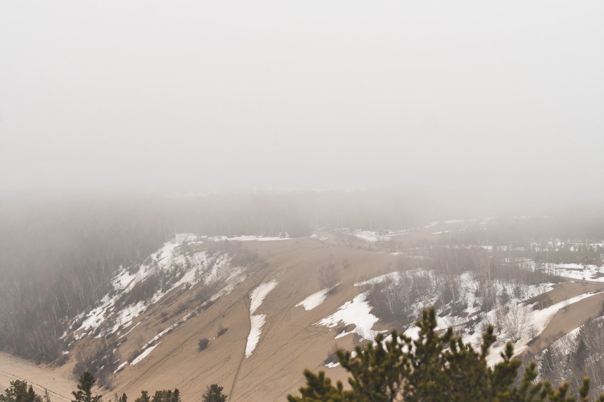 Munising Michigan cliffs and waterfall shrouded in lake fog