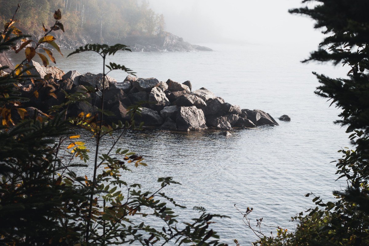 Marquette Michigan lighthouse on fog-covered Lake Superior breakwall