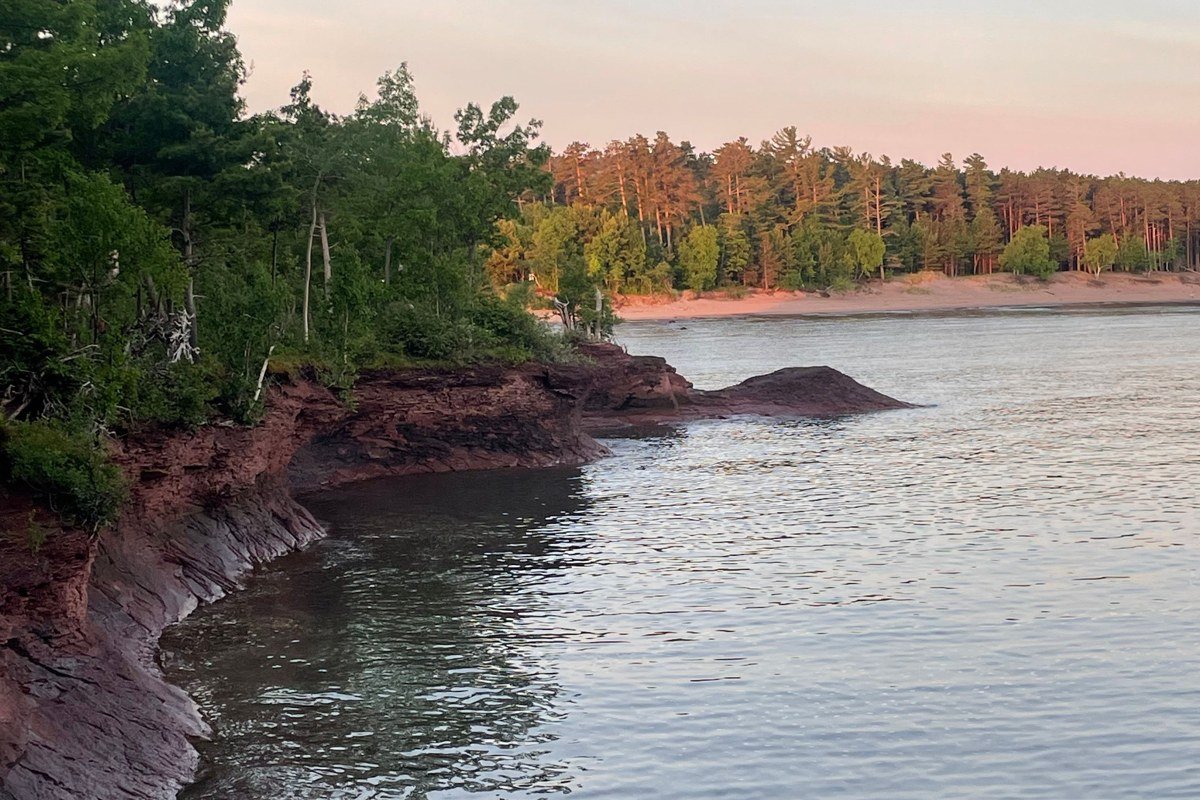 Copper Harbor Michigan rocky point with fog over Lake Superior and pines