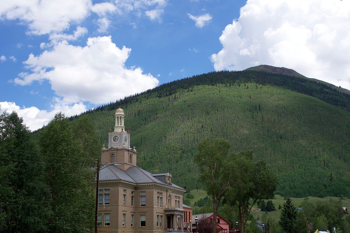 Fayetteville West Virginia main street with outdoor gear shops and mountain backdrop
