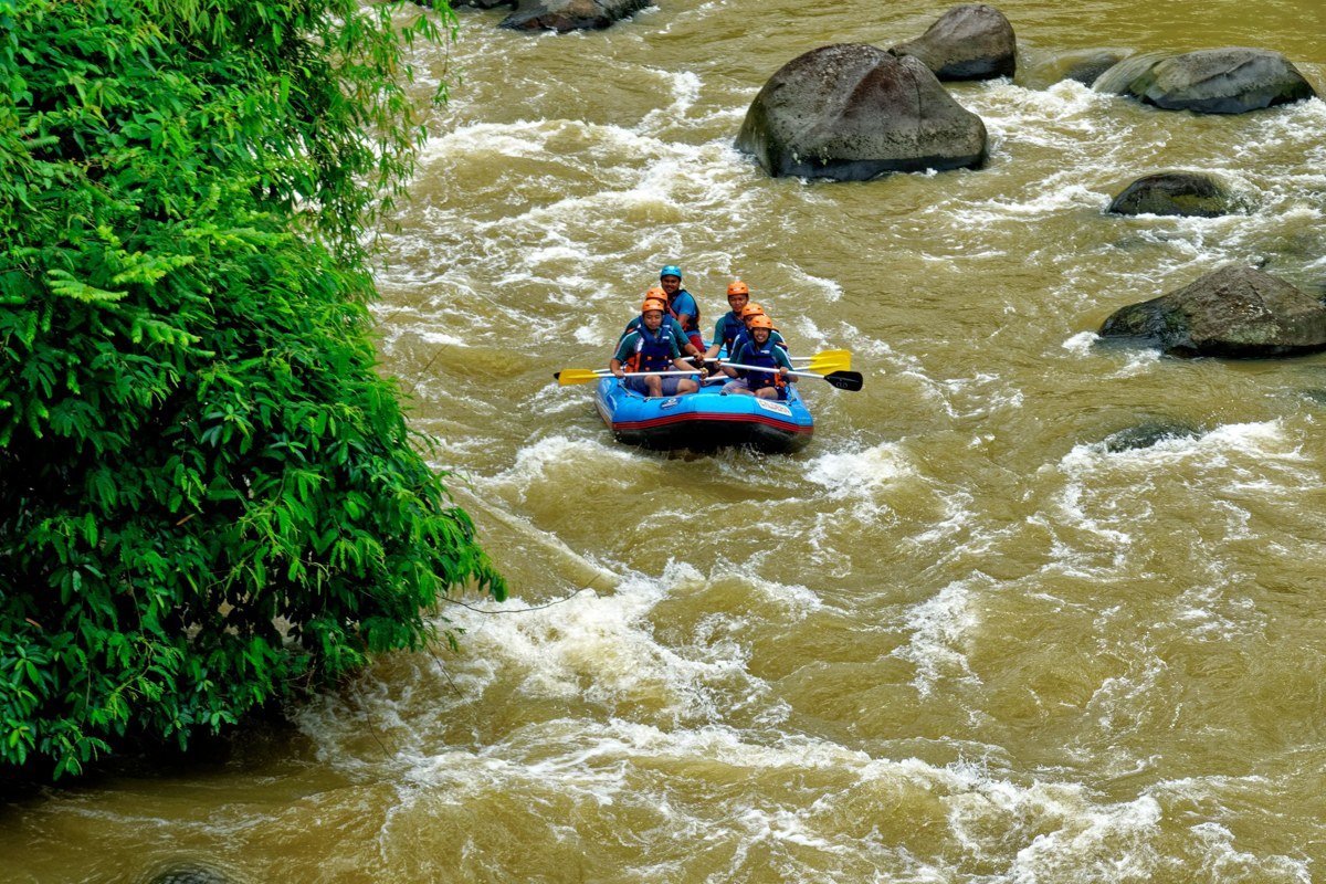 rafters navigating rapids on the Lower Gauley River West Virginia surrounded by forest
