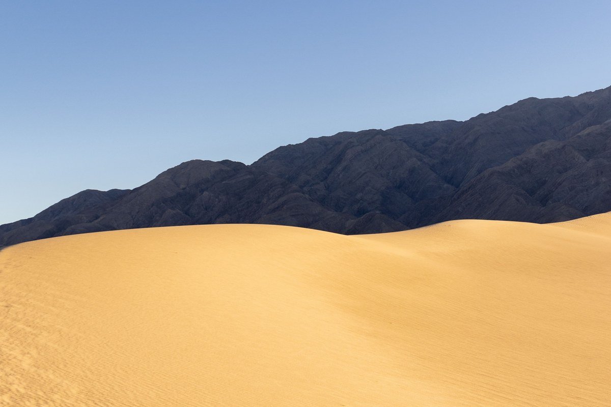 White Sands National Park Dunes Drive at blue hour, pale dunes against darkening sky