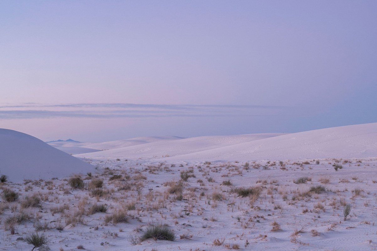 Playa Trail White Sands at twilight, dry lakebed reflecting purple and blue sky