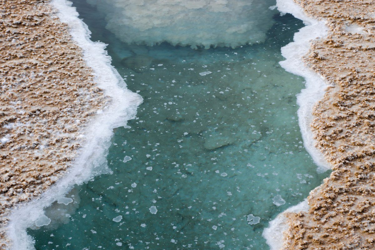 Lake Lucero White Sands New Mexico, selenite crystals on dry lakebed at golden hour