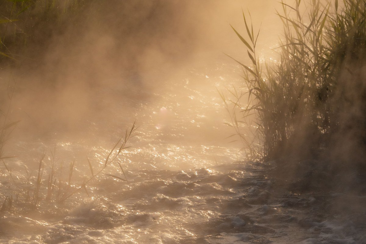 Tahquamenon Falls Michigan amber water mist rising at sunrise